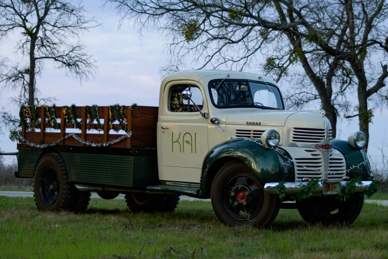 a old pick up truck that is parked on the grass