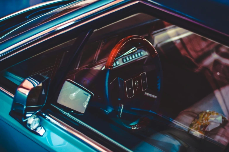 a very nice looking old car with a steering wheel