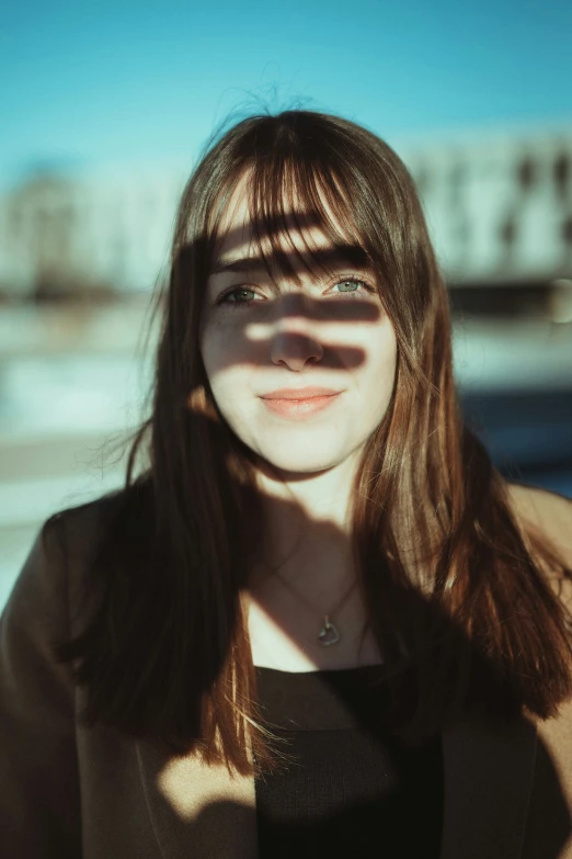 the light is cast on the woman's face with long hair