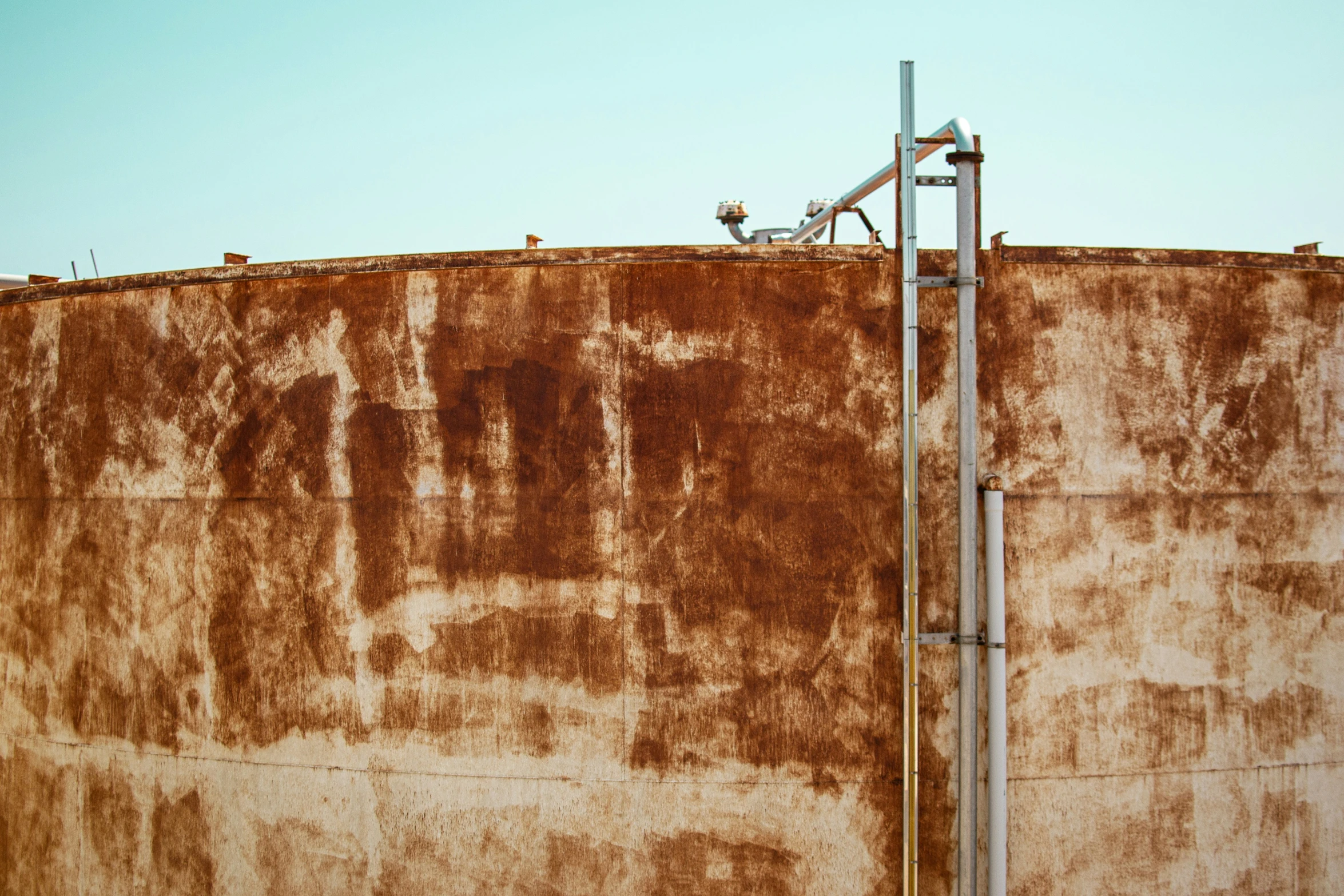 an old rusty water tank with no roof