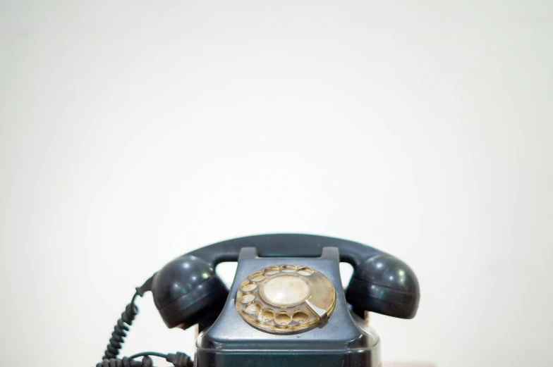 an old phone on the counter of a restaurant