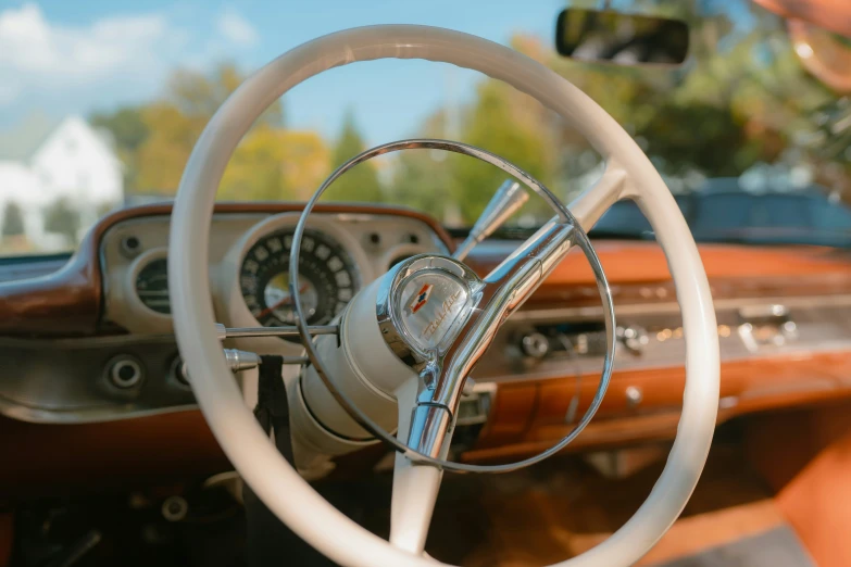 the steering wheel and dash board of a car