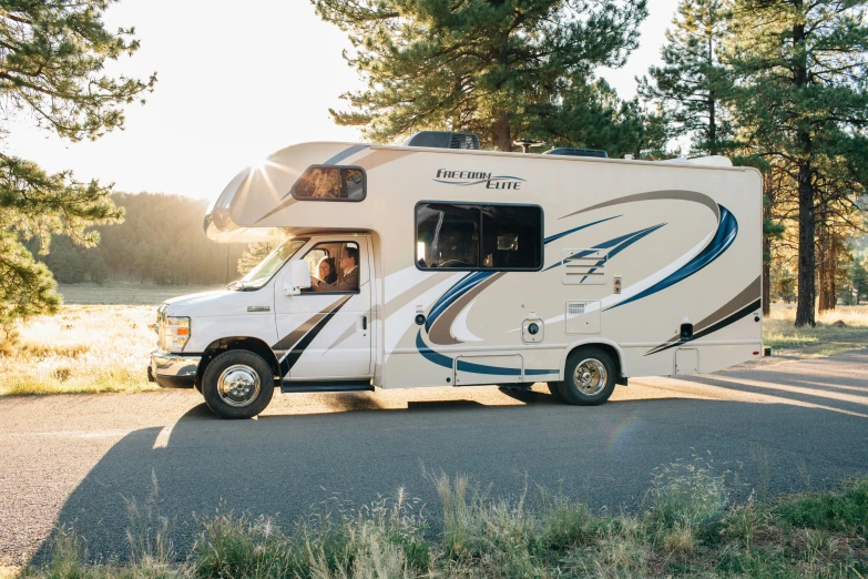 a travel trailer parked on the side of a road