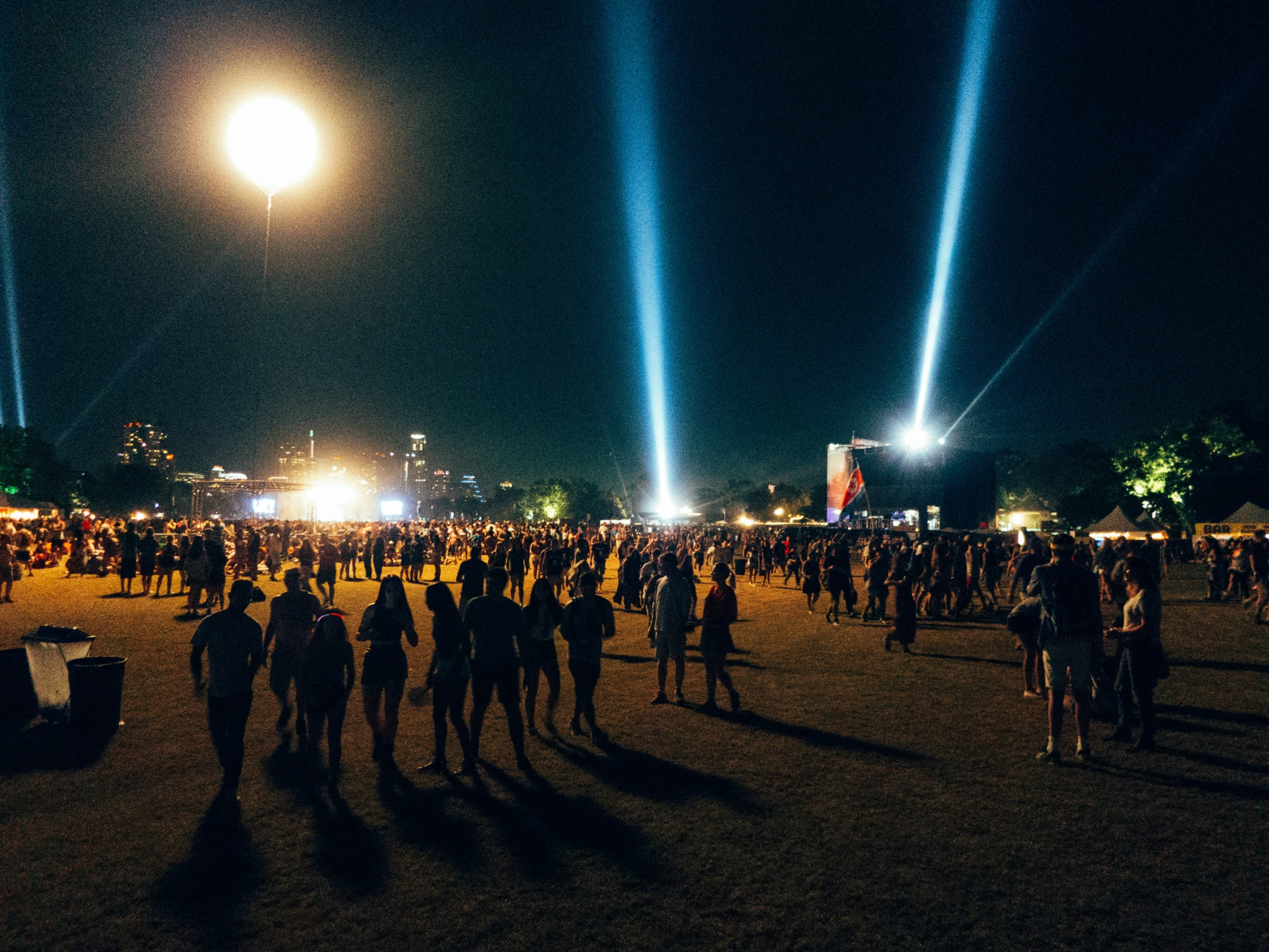 people are seen dancing around at a concert