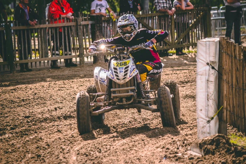 a person on a small atv in the dirt