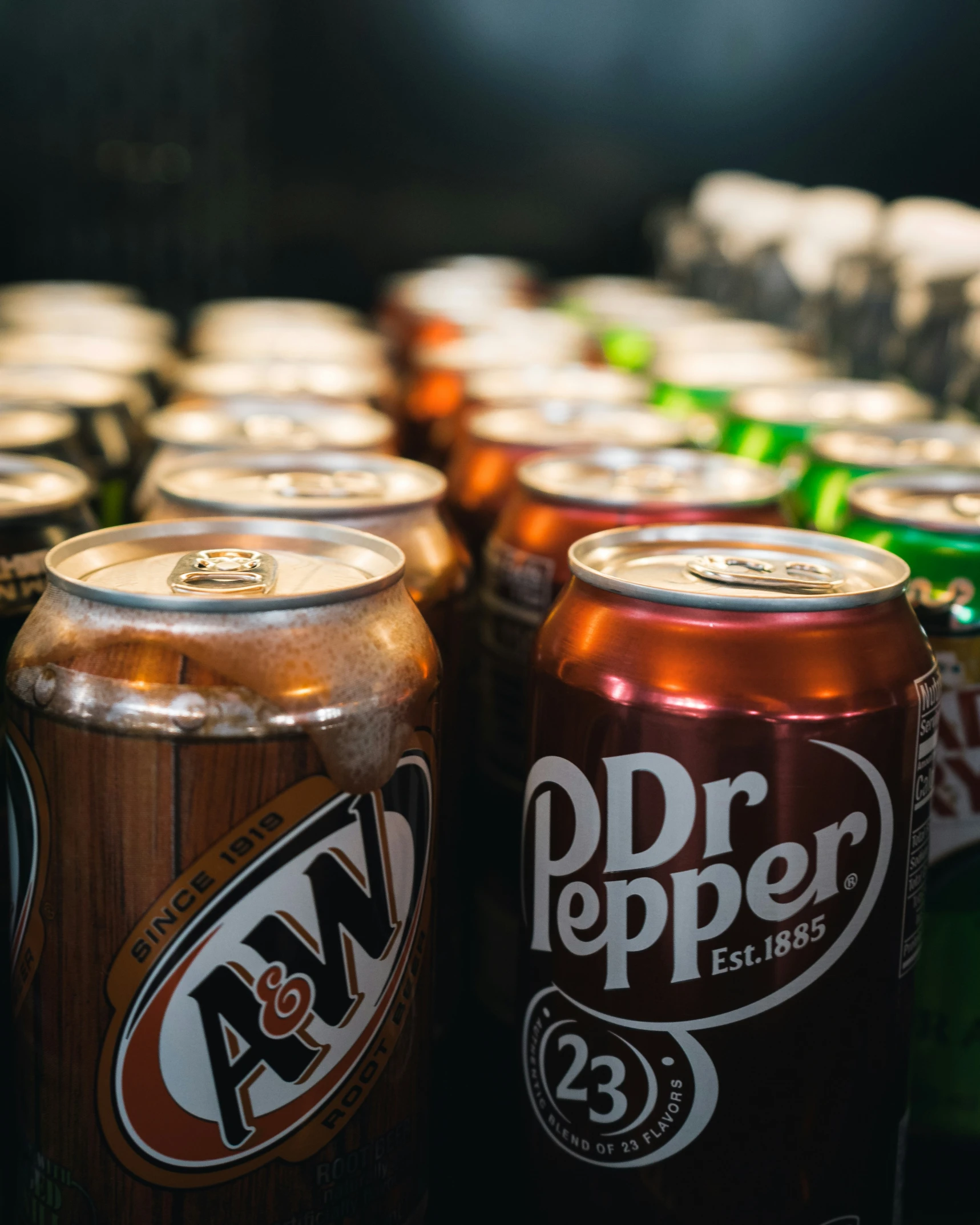 a close up of several canned cans of soda