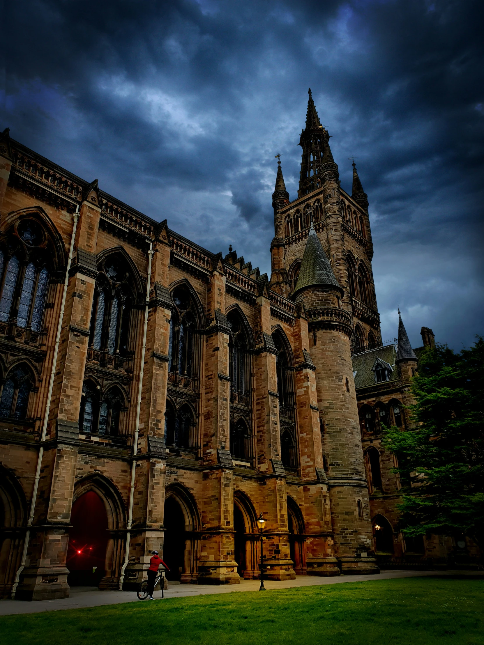 a large building with gothic arches in the background