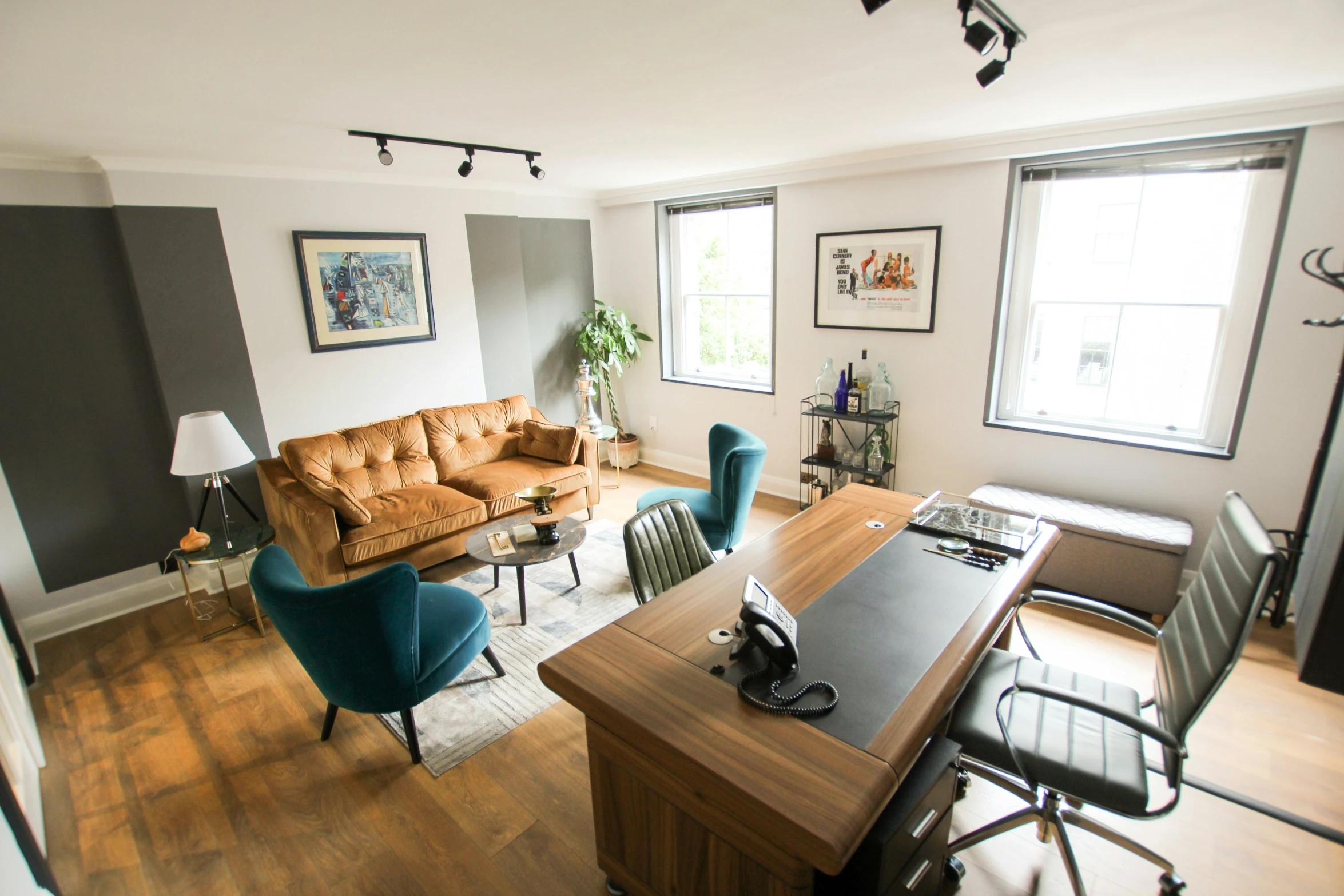 an office area with furniture and a desk