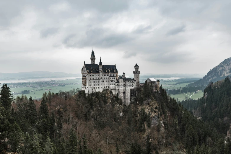 a castle sitting on top of a rocky mountain