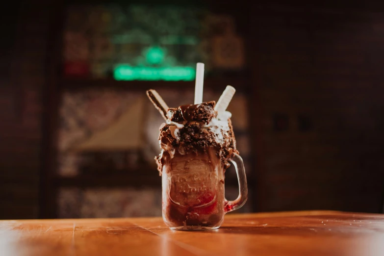 iced coffee in a mug with two white straws