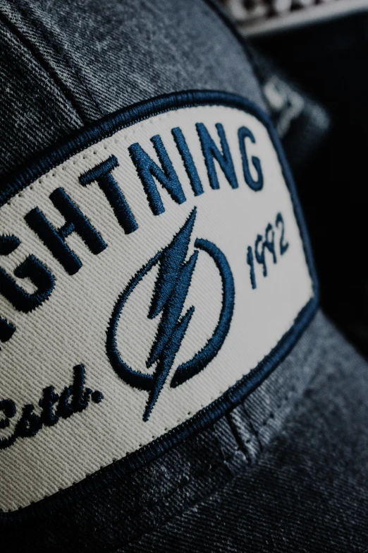 the lightning logo is on top of a hat