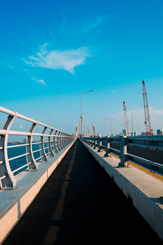 a walkway on a bridge over the water