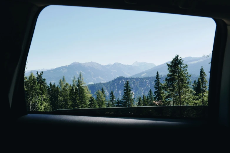 a scenic mountain scenery seen from a vehicle window