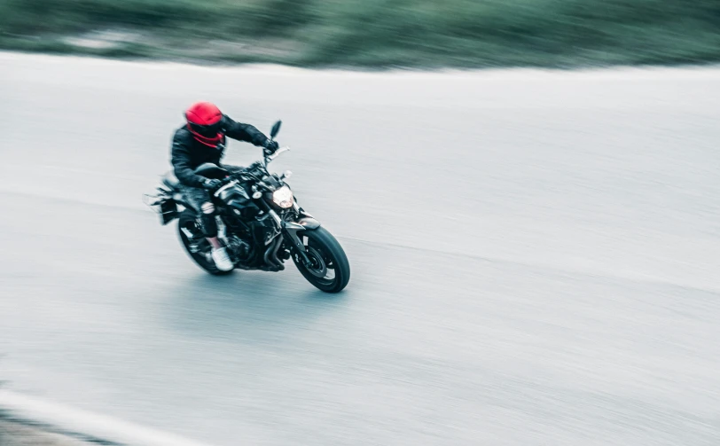 a person riding a motorcycle on a street