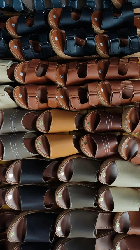 rows of leather sandals lined up in different colors