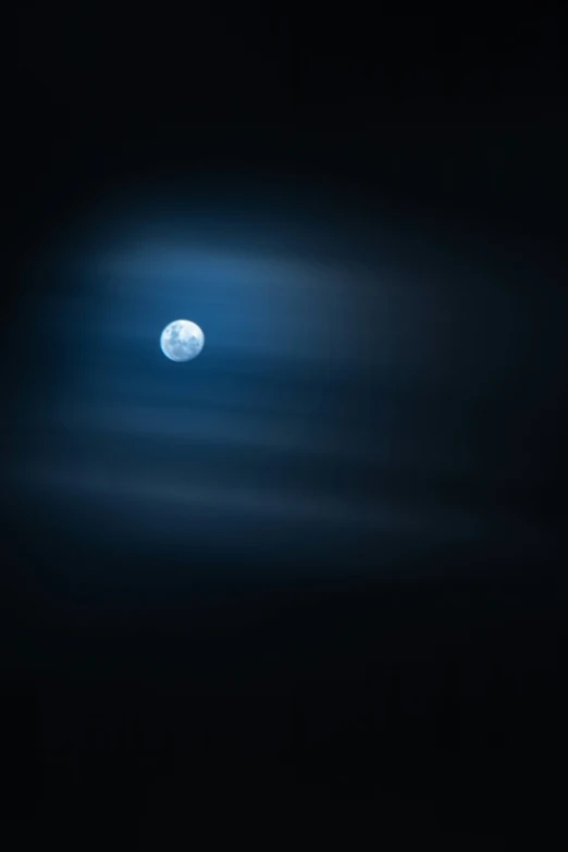 a full moon seen through a telescope lens