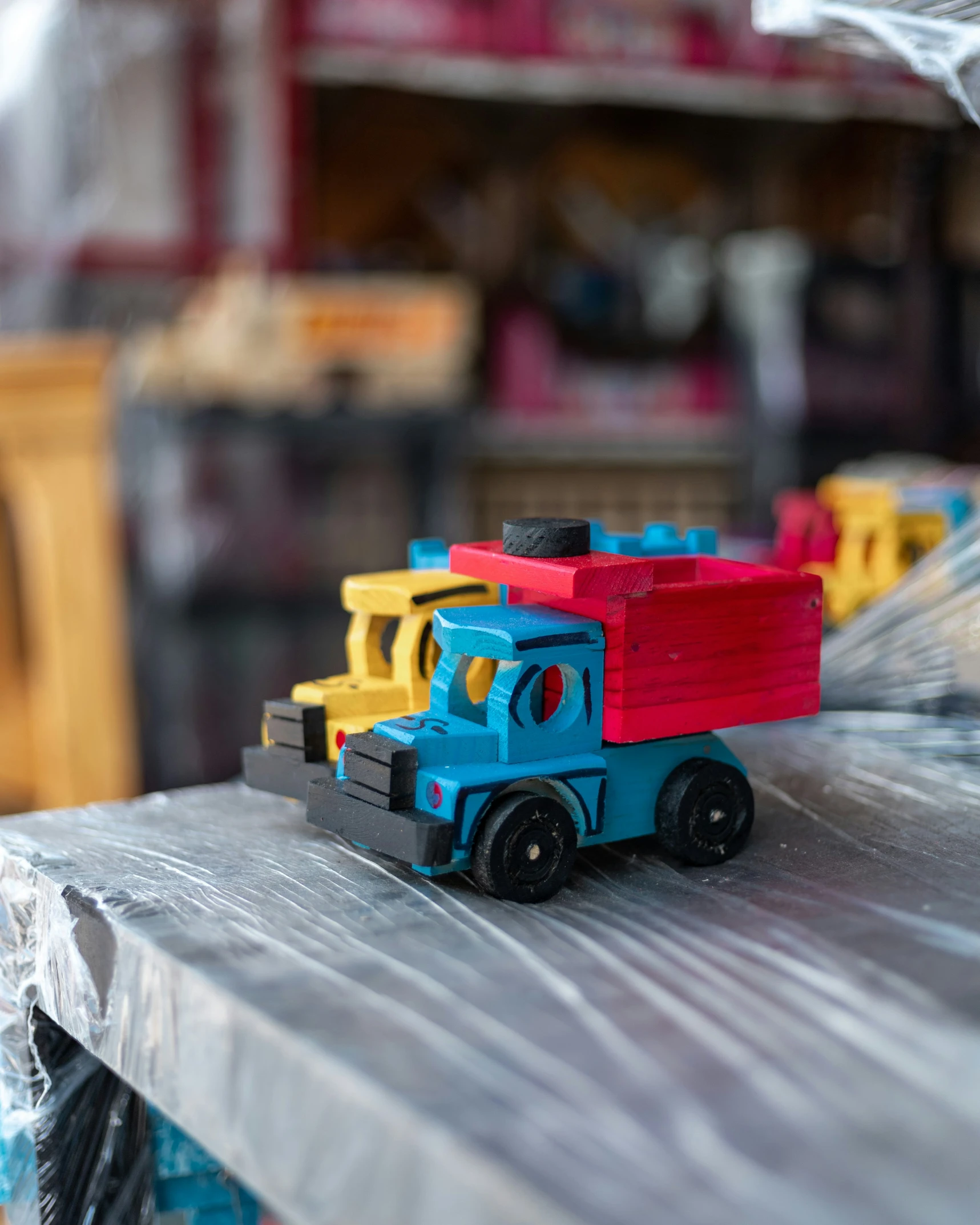 a toy truck on top of a wood table