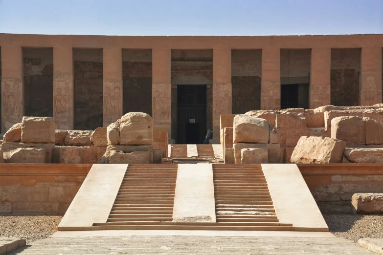 the ancient building has many stone steps and stone walls