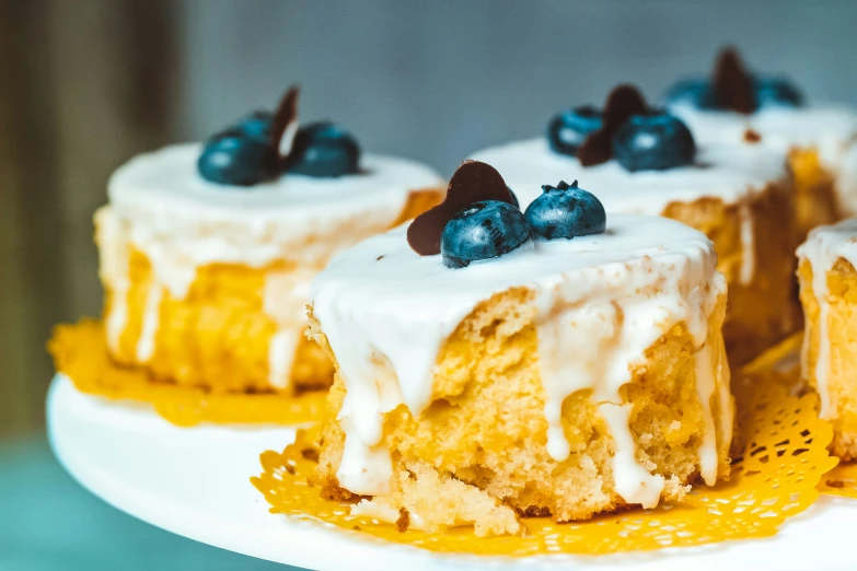 a piece of dessert cake with whipped cream and blueberries on top