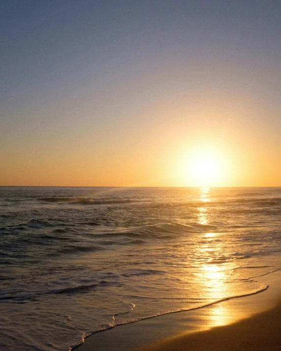 a view of the sunset from the ocean