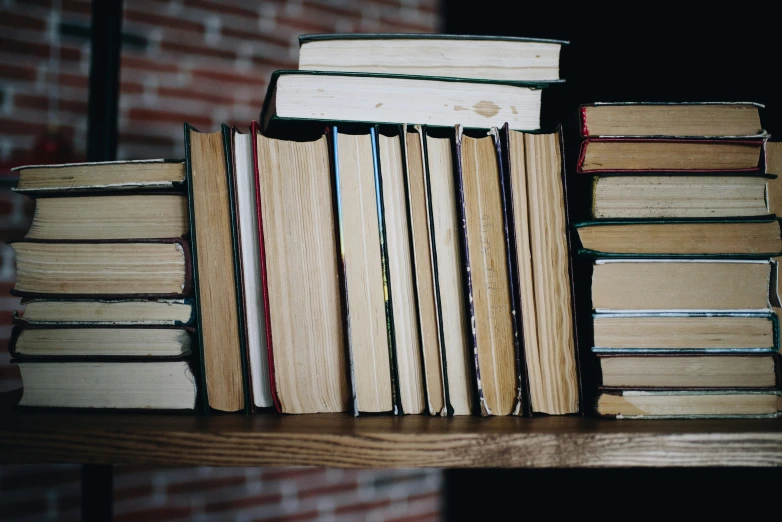 several books stacked on top of one another