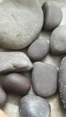 a bunch of rocks in a bowl of water
