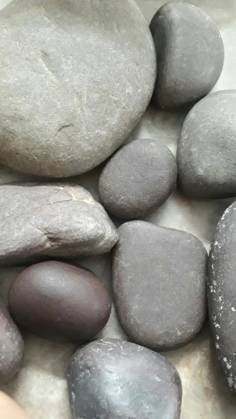 a bunch of rocks in a bowl of water