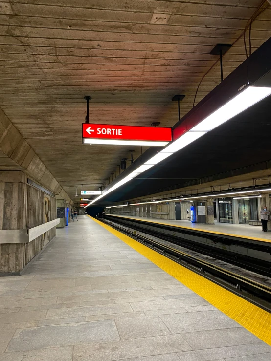 a train station that has a train parked next to it