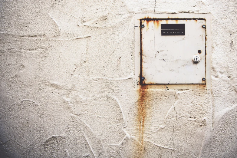 a metal object is attached to a white wall