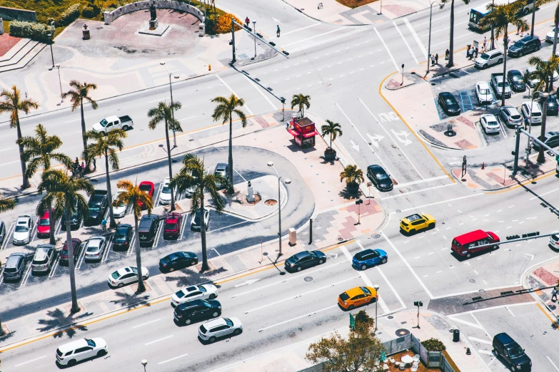 an aerial view of city streets with palm trees