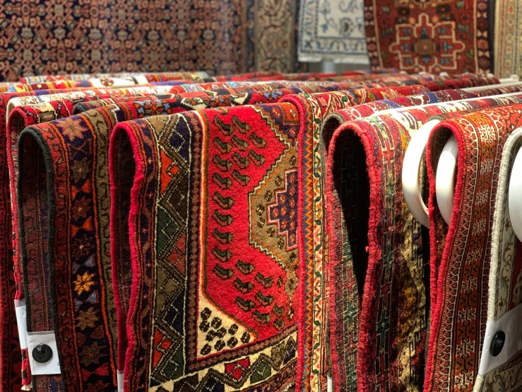 rows of colorful carpet carpets lined up in rows