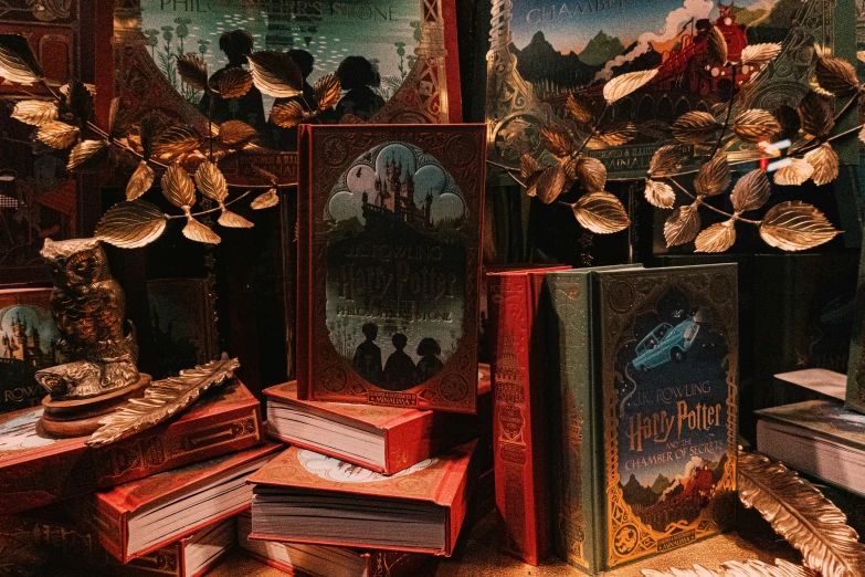 a pile of books sitting on top of a wooden table