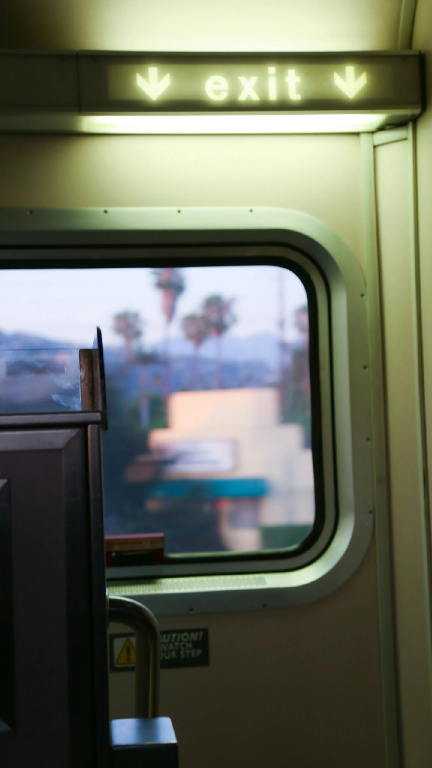 looking out the window of a vehicle on a train