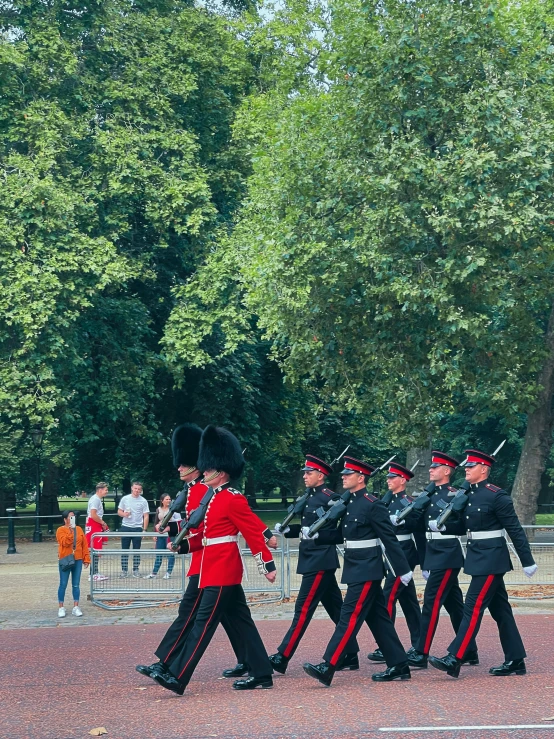 a parade marching of men and women in uniform