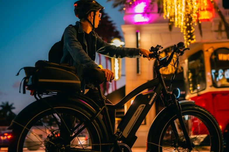 a person on a bicycle looking at their phone