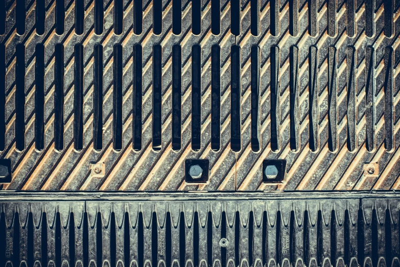 the sides of an old wall with many holes