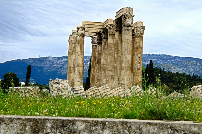 ancient ruins with mountains in the background