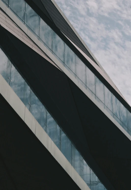 an airplane flying in the sky near a building