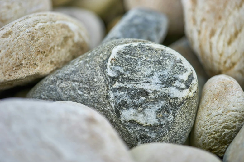 a rock sitting on top of other rocks