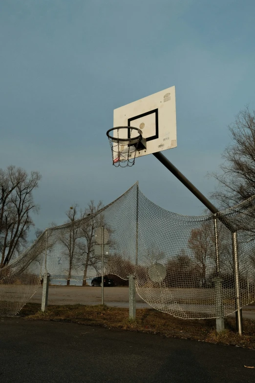 a basketball hoop is flying high into the air