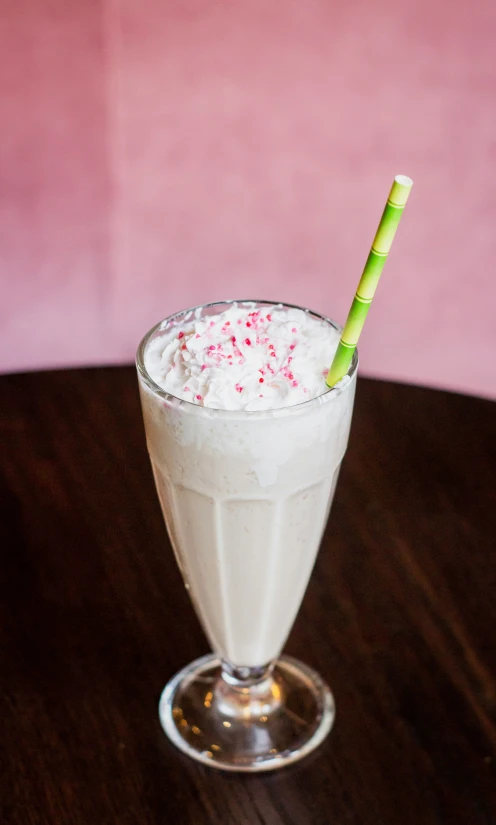 a beverage with sprinkles is on the table