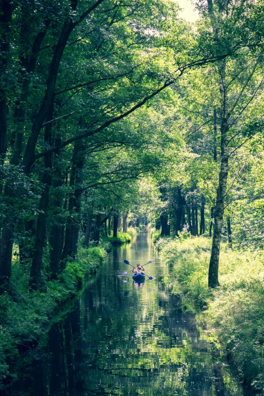 a boat that is floating down some water