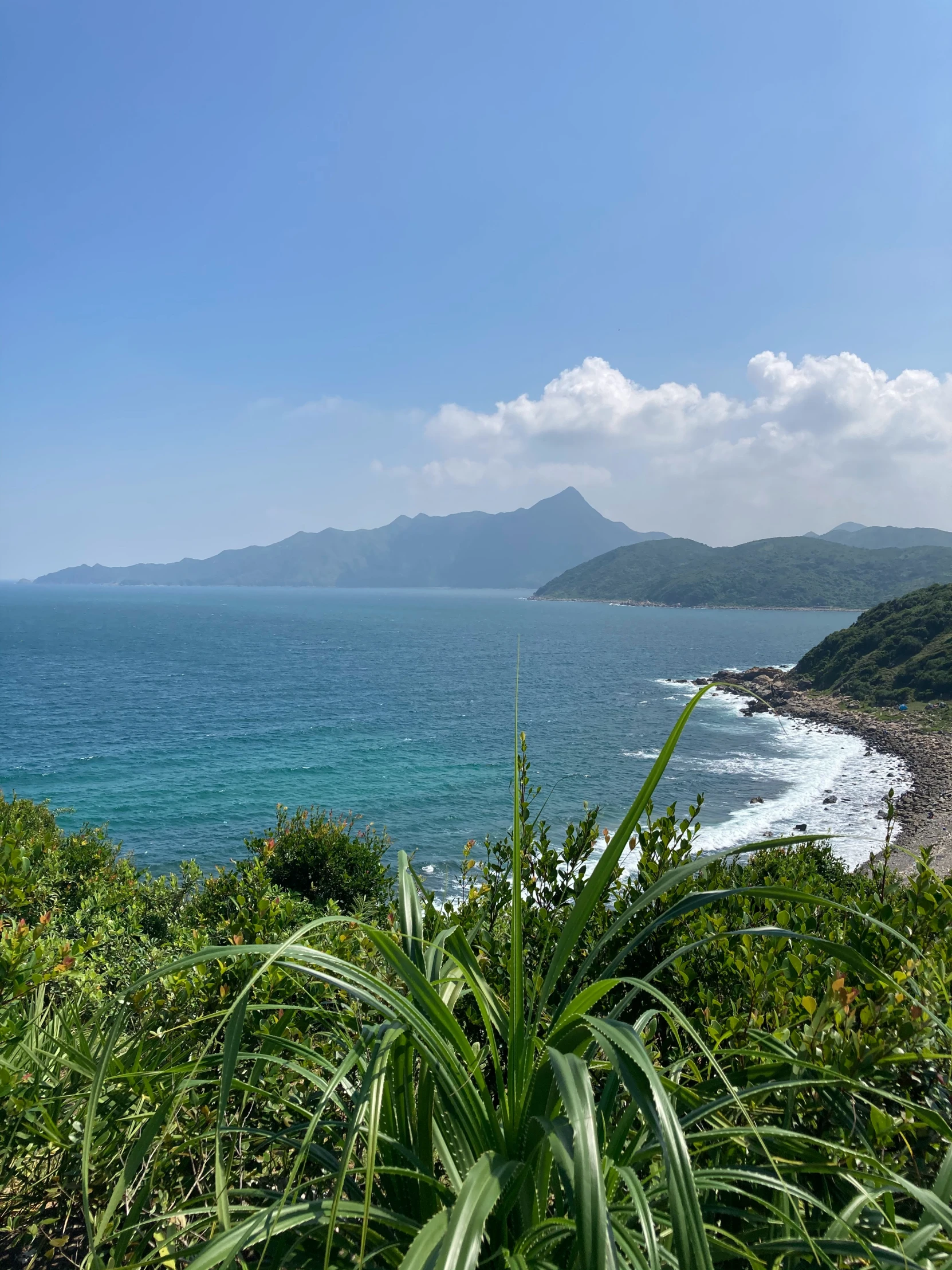 looking out to sea from the mountains on a sunny day