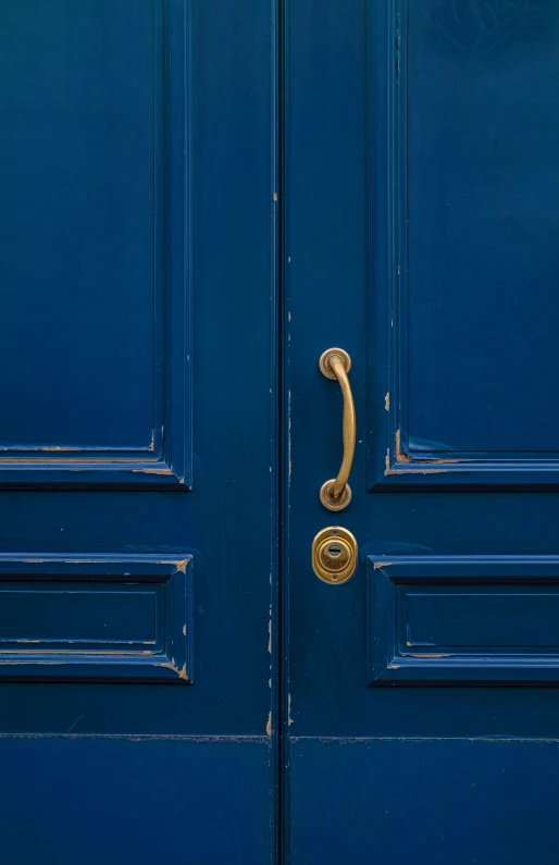 the front door is painted a bright blue color