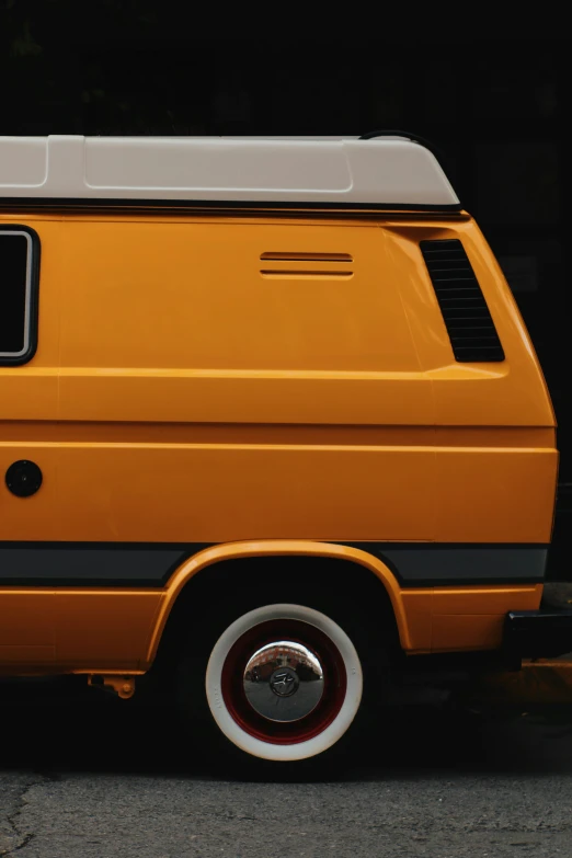 a yellow van with the doors open in a parking lot