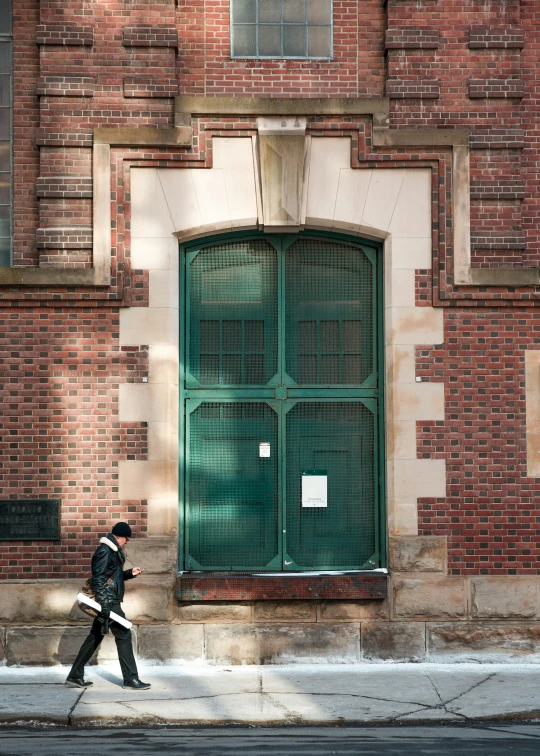 a man walking in front of an empty street