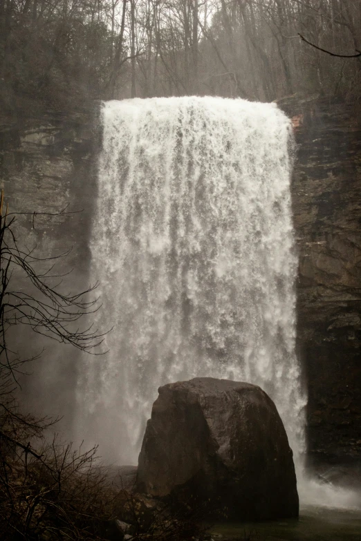 a big waterfall in the middle of the woods