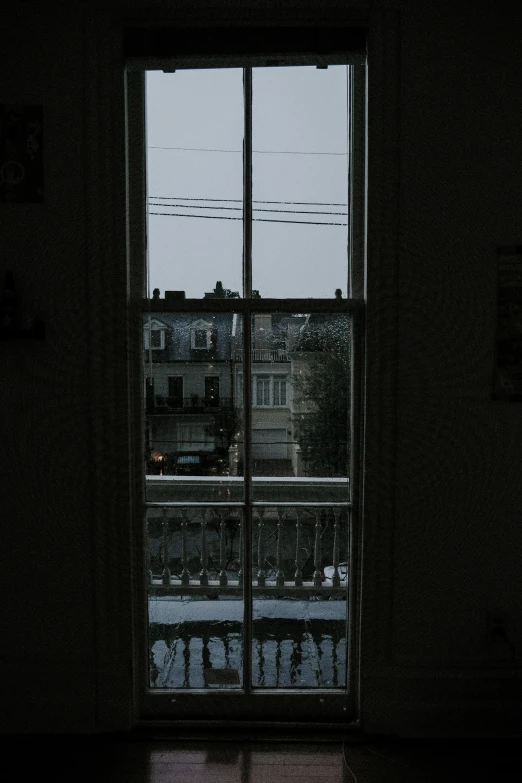 there are two windows looking out on the city