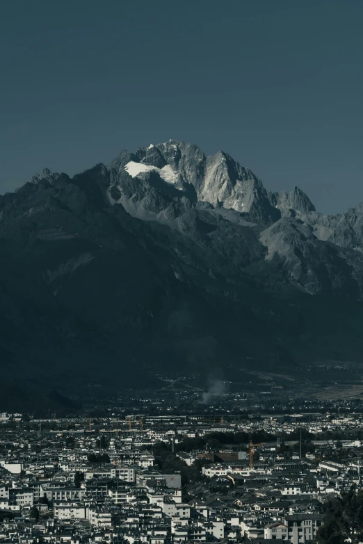 a black and white pograph of a large snowy mountain