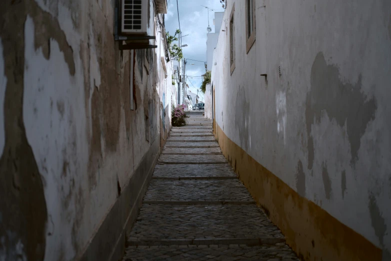 there is an alley with brick steps to it